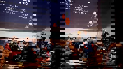 Panel on stage in the Society's Ondaatje Theatre.