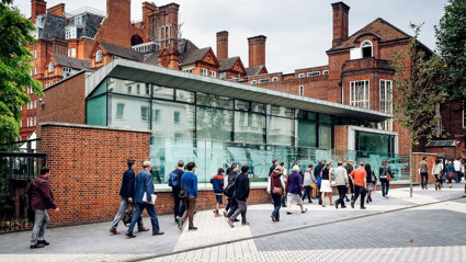 Outside view of the RGS' building with people passing by the RGS pavilion on Exhibition Road.